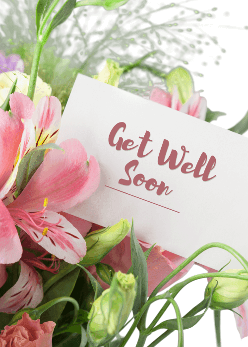 Photographic get well soon card with white note reading Get Well Soon tucked into a lush bouquet of pink flowers including alstroemeria and roses
