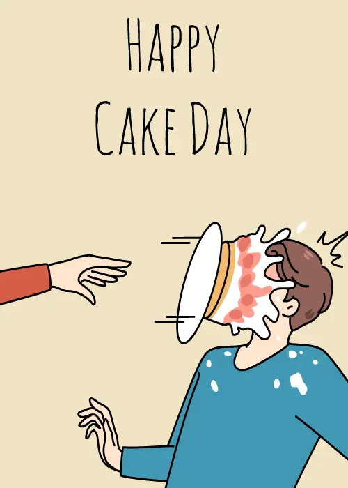 Funny birthday card on warm cream background with large hand-lettered Happy Cake Day text above humorous illustration of man in teal sweater getting round birthday cake with white frosting and strawberries smashed into his face